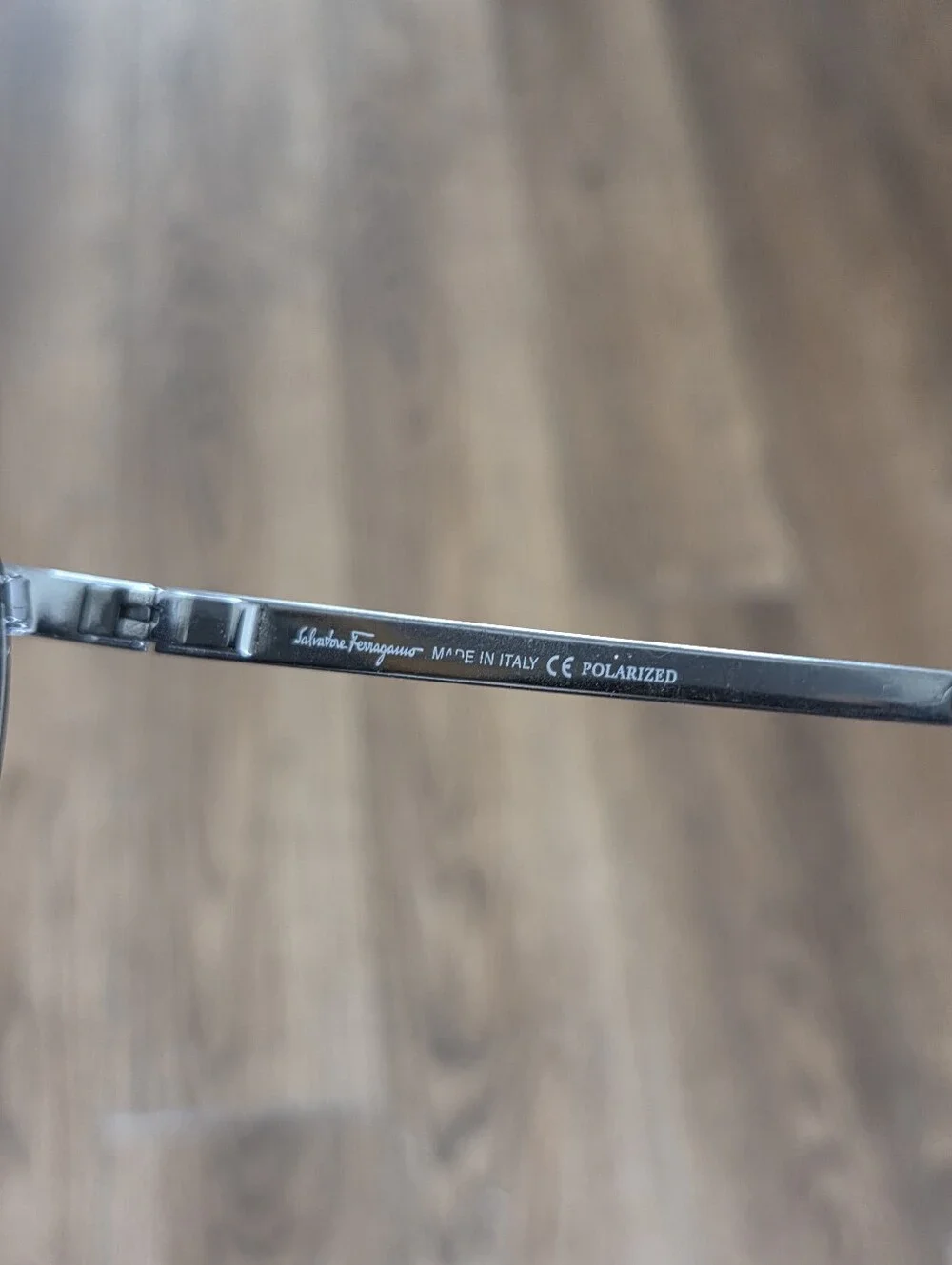 Salvatore Ferragamo Silver Frame Sunglasses with Black Lenses